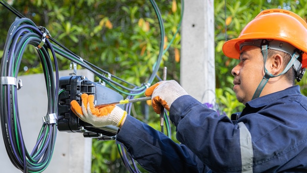 network engineer working with cables